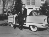 President of American Motors George W. Romney Getting Out of His Car Impressão fotográfica premium por Grey Villet