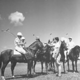 Polo Players Preparing for a Game at the Canlubang Country Club Lámina fotográfica por Carl Mydans