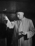 Man Examining the Clearness of the Wine and Decides it Will Be a Good Year Lámina fotográfica