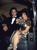 Actors Michael Nader and Joan Collins Sitting in a Car Lámina fotográfica de primera calidad por John Paschal