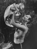 Actor Charlton Heston Lifting Son Fraser, Portraying the Baby Moses, in 