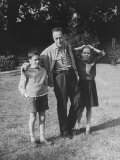 French Author Albert Camus Poised Standing on Lawn, Arms around His Twins Jean and Catherine Lámina fotográfica de primera calidad por Loomis Dean
