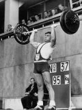 Iranian Weight Lifter M. Namdjou Struggling to Hold Up 206.5 Pound Weight at 1952 Olympics Lámina fotográfica de primera calidad