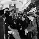 Folk Singer Woody Guthrie Playing His Guitar for Commuters on a Subway Train Lámina fotográfica de primera calidad