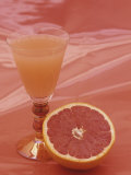 Grapefruit and Juice Photographic Print by Wally Eberhart