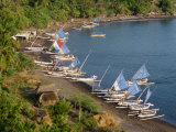Outrigger Fishing Boats Line the Beach on the East Coast of Bali, on the Lombok Strait Photographic Print by Alain Evrard