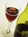 Bottle and Glass of Red Wine Photographic Print by Miller John