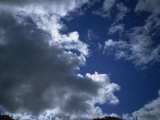 Dark Clouds and Blue Sky Photographic Print by Hunter David