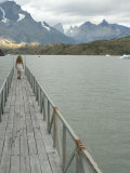 Blonde Woman Walks to the End of Dock on Lago Grey, Torres Del Paine, Chile, South America Photographie par McCoy Aaron