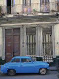 Blue Car Parked Outside a Shabby House in Old Havana, Cuba, West Indies, Central America Photographic Print by Mawson Mark