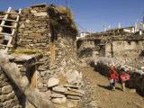 Two Schoolchildren and Typical Stone Houses on Village Street, Nako, Spiti, Himachal Pradesh, India Photographic Print by Simanor Eitan