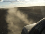 Dust Kicks Up from Behind of Car in Patagonia, on the Infamous Route 40, Southern Argentina Photographie par McCoy Aaron