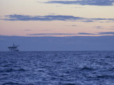 Gas Platform Silhouetted on Horizon at Dusk, Morecambe Bay Gas Field, Lancashire, England, UK Photographic Print by Wood Nick