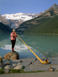 Man with an Alpenhorn Beside Lake Louise in the Banff National Park, Alberta, Canada, North America Photographic Print by Renner Geoff