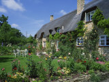 Thatched Cottages in the Cotswolds, Gloucestershire, England, UK Photographic Print by Rainford Roy