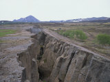 Rift Where Earth Is Splitting at Plate Boundary, Grotagja, Lake Myvatn Region, Iceland Photographic Print by Renner Geoff