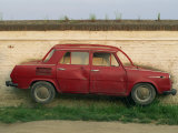 Half a Skoda on a Wall in a Car Salesyard Near Piestany, Slovakia, Europe Photographic Print by Strachan James