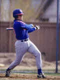Baseball Player in Action Batting Photographic Print