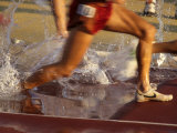 Detail of Runners Feet in Water Jump of Steeplechase Race Photographic Print