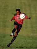 Soccer Player in Action Photographic Print