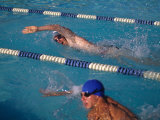 Male Swimmer Competing in Abutterfly Race Photographic Print