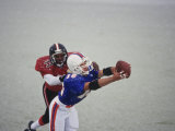 American Football Player Reaching for the Ball Photographic Print