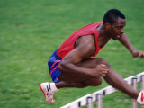 Male Hurdler in Action Photographic Print by Paul Sutton