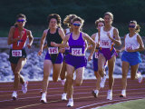Female Runners Competing in a Track Race Lámina fotográfica