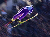Blurred Action of Ski Jumper Flying Throught the Air Photographic Print