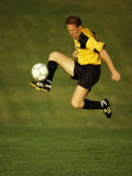 Soccer Player in Action Photographic Print