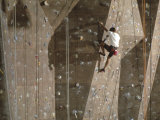 Man Wall Climbing Indoors with Equipment Lámina fotográfica