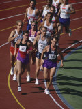 Male Runners Competing in a Track Race Lámina fotográfica