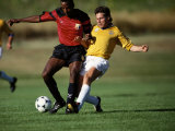 Soccer Players Fighting for the Ball Photographic Print