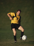 Soccer Player in Action Photographic Print