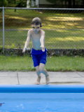 9 Year Old Boy Jumping into the Swimming Pool, Kiamesha Lake, New York, USA Photographic Print by Paul Sutton