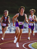 Female Runners Competing in a Track Race Photographic Print