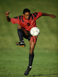 Soccer Player in Action Photographic Print