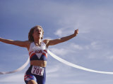 Female Runner Victorious at the Finish Line in a Track Race Photographic Print