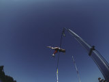 Pole Vaulter Flys over the Bar Photographic Print by Steven Sutton