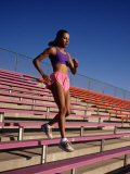 Woman Training on Stadium Stairs Photographic Print