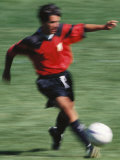 Blurred Action of Male Soccer Player Photographic Print
