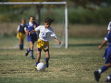 8 Year Old Girl in Action Durring Soccer Game, Lakewood, Colorado, USA Photographic Print