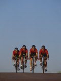 Road Cycling Team in Action Photographic Print