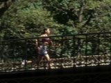 Hispanic Woman Running for Exercise, New York, New York, USA Photographic Print by Paul Sutton