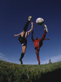 Soccer Players Fighting for the Ball Photographic Print