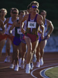 Male Runners Competing in a Track Race Lámina fotográfica