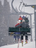 Couple Riding Up the Ski Lift During a Snow Storm, Vail, Colorado, USA Photographic Print by Paul Sutton