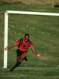 Soccer Player Celebrating after Scoring a Goal Photographic Print