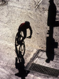 Shadow and Silhouette of Cyclistist and Pedestrian, New York, New York, USA Photographic Print
