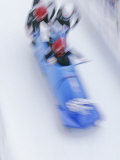 Blurred Action of 4 Man Bobsled Team Pushing Off at the Start Photographic Print